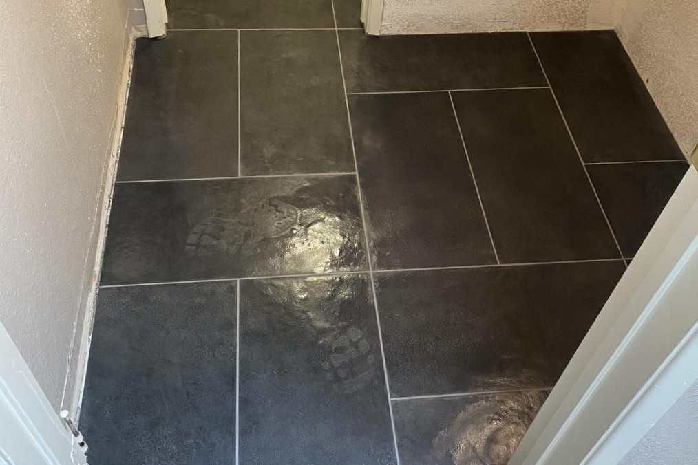 Black porcelain tile flooring installed in a San Diego home by licensed tile installers